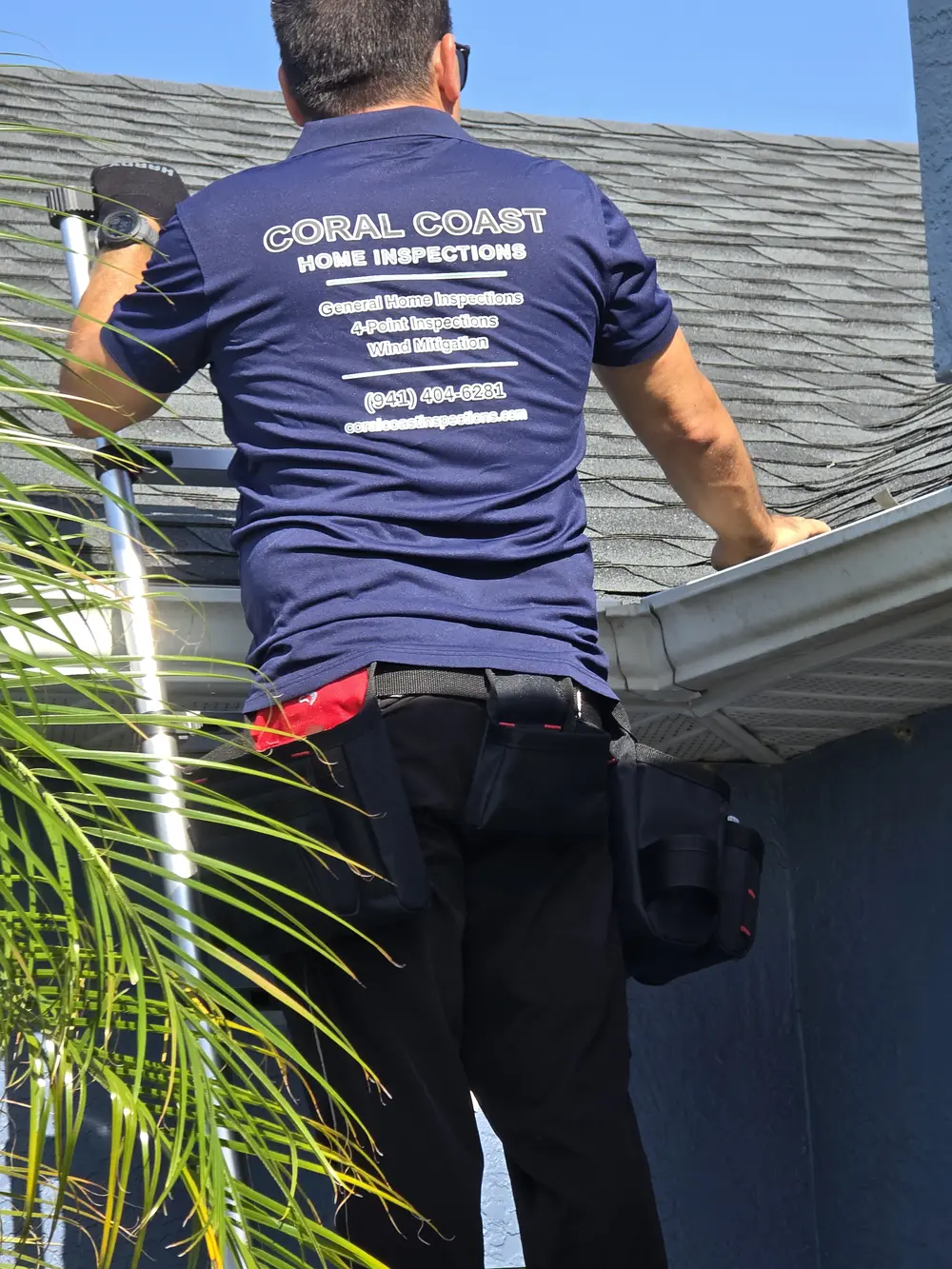 Alexis Cardenas of Coral Coast Home Inspections inspecting a roof and gutter